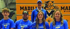 Korlee Cunningham-Martin, second from right, gets support from her family and coach. From left to right: Kamden Martin, Chase Martin, Korlee and Savannah Martin. Back: Rylan Hincher, Tabor College Head Cross Country Coach. Courtesy photo